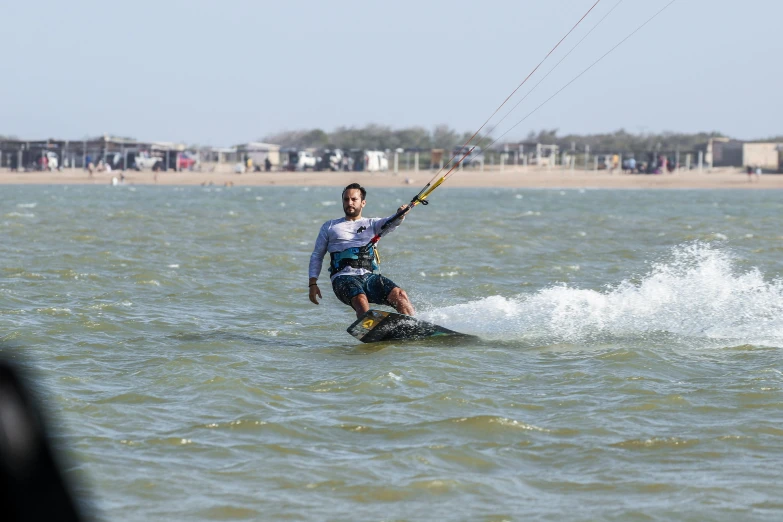 a man on a surfboard in the water