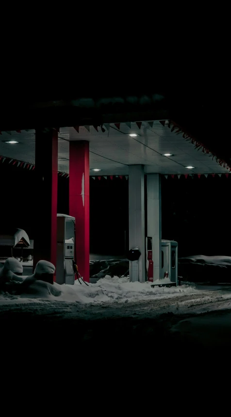 a car parked at a gas station at night