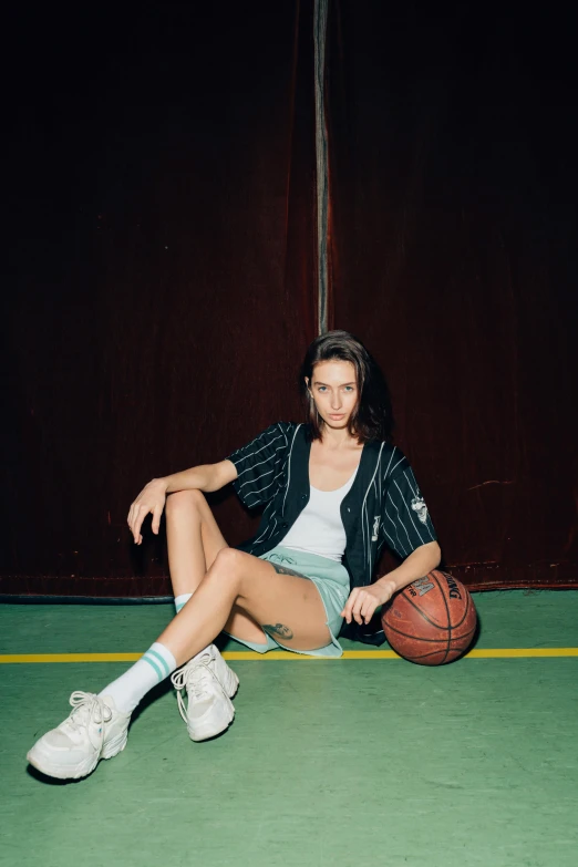 a female basketball player with a white shirt on