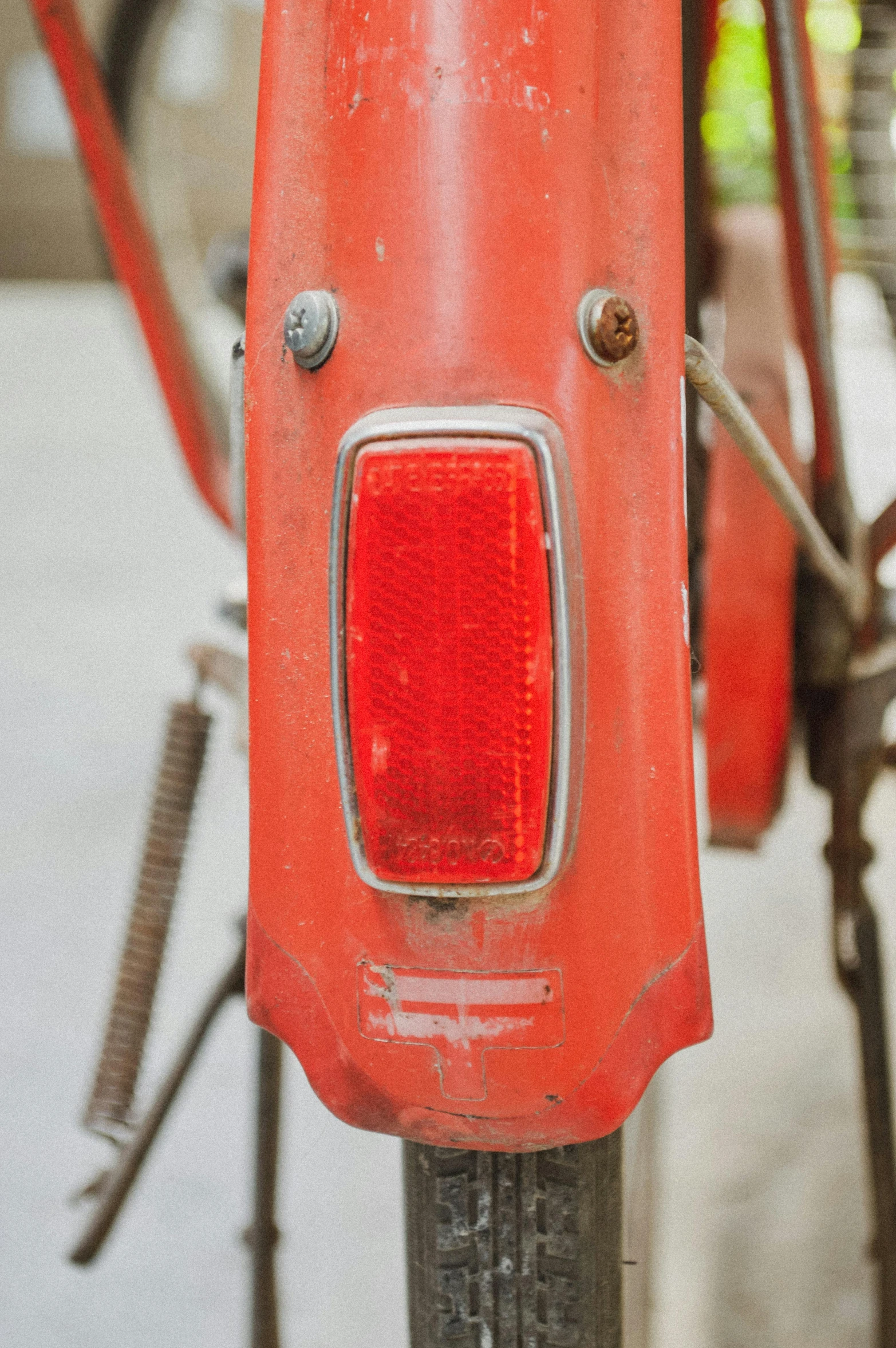 an old fashioned red motorbike is on display