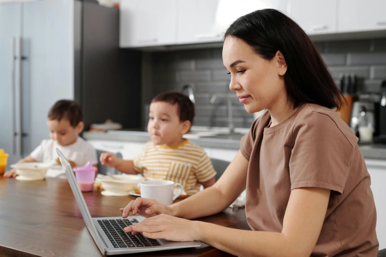 woman typing on laptop while three s watch