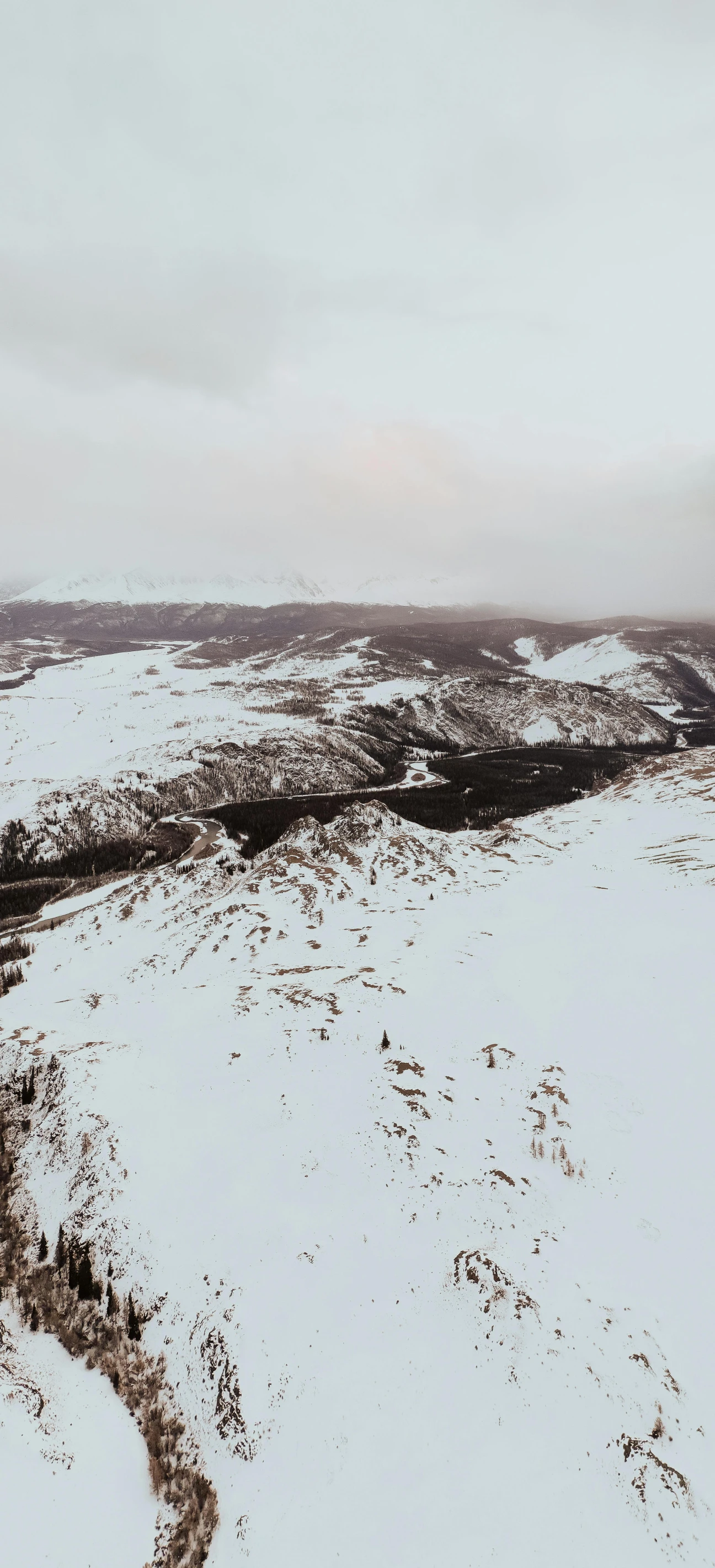 a snowy landscape with an aerial view of the area