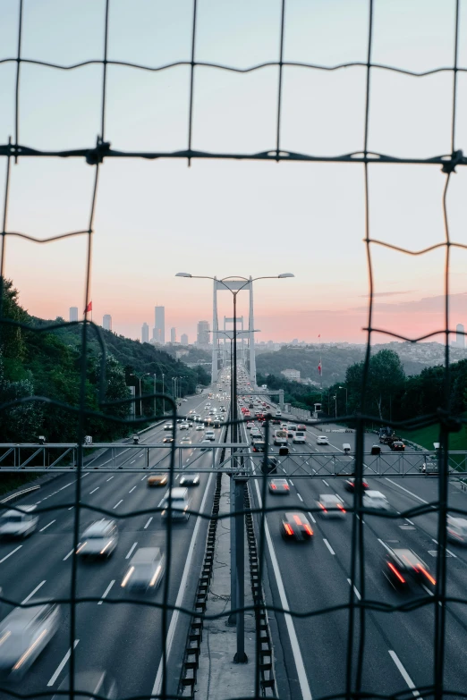 the view from behind a fence of the highway