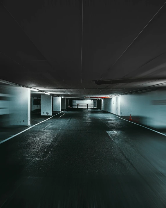 the inside of a parking garage, with a clock tower