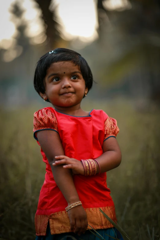 an indian girl is posing for the camera