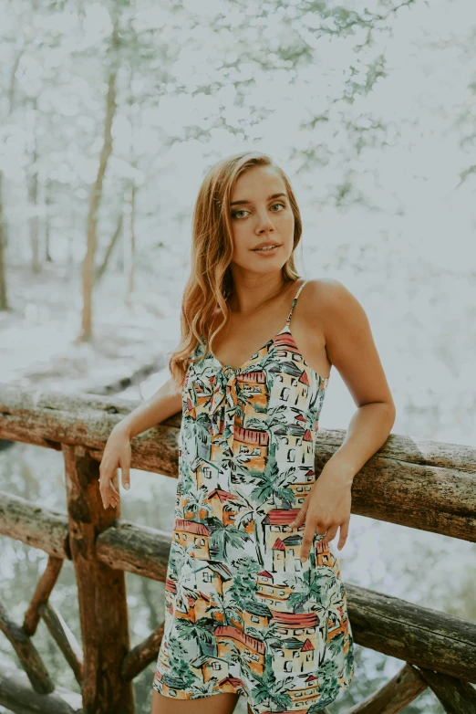 the model poses on the bridge outside during winter