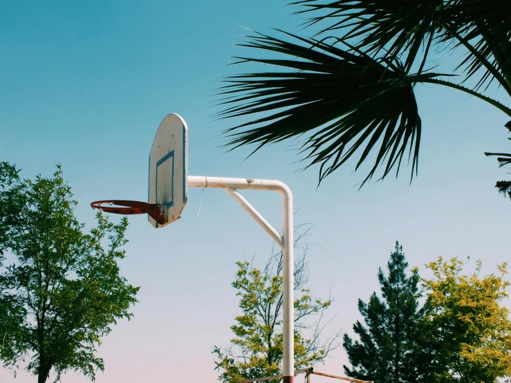 an over head s of a basketball hoop with the net pulled back