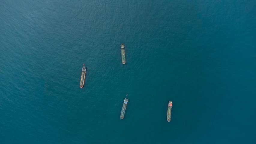 a group of ships are sailing together in the ocean