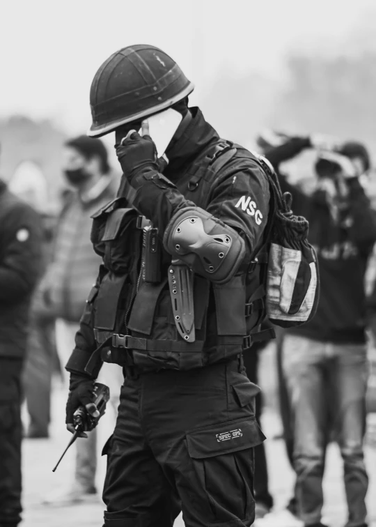 a man with military gear on walking down the street