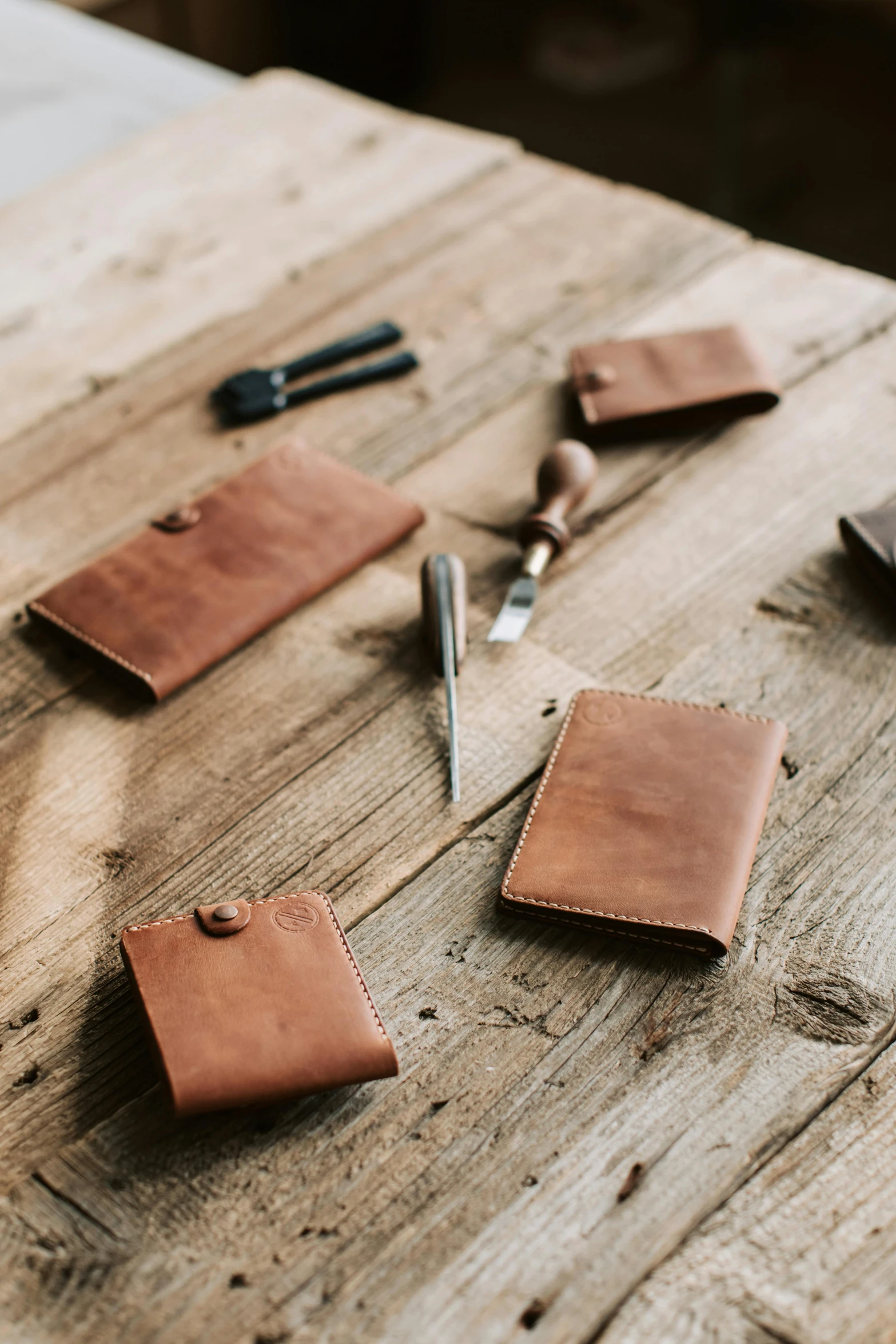 three leather items laid out on a table