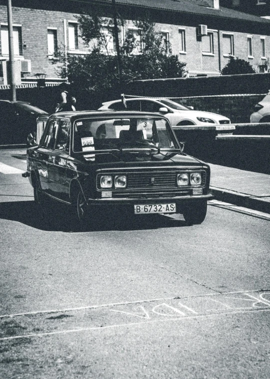 a vintage black and white po of a car