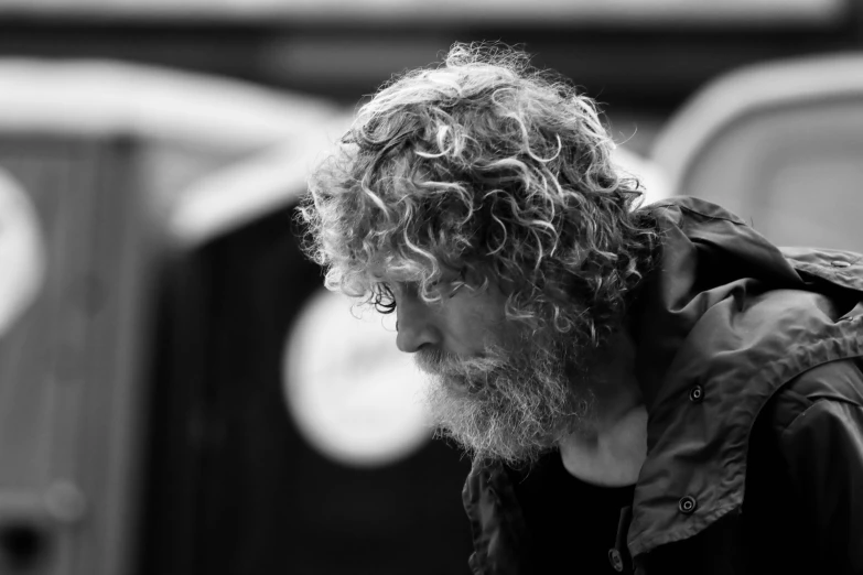 a man with a beard wearing a leather jacket