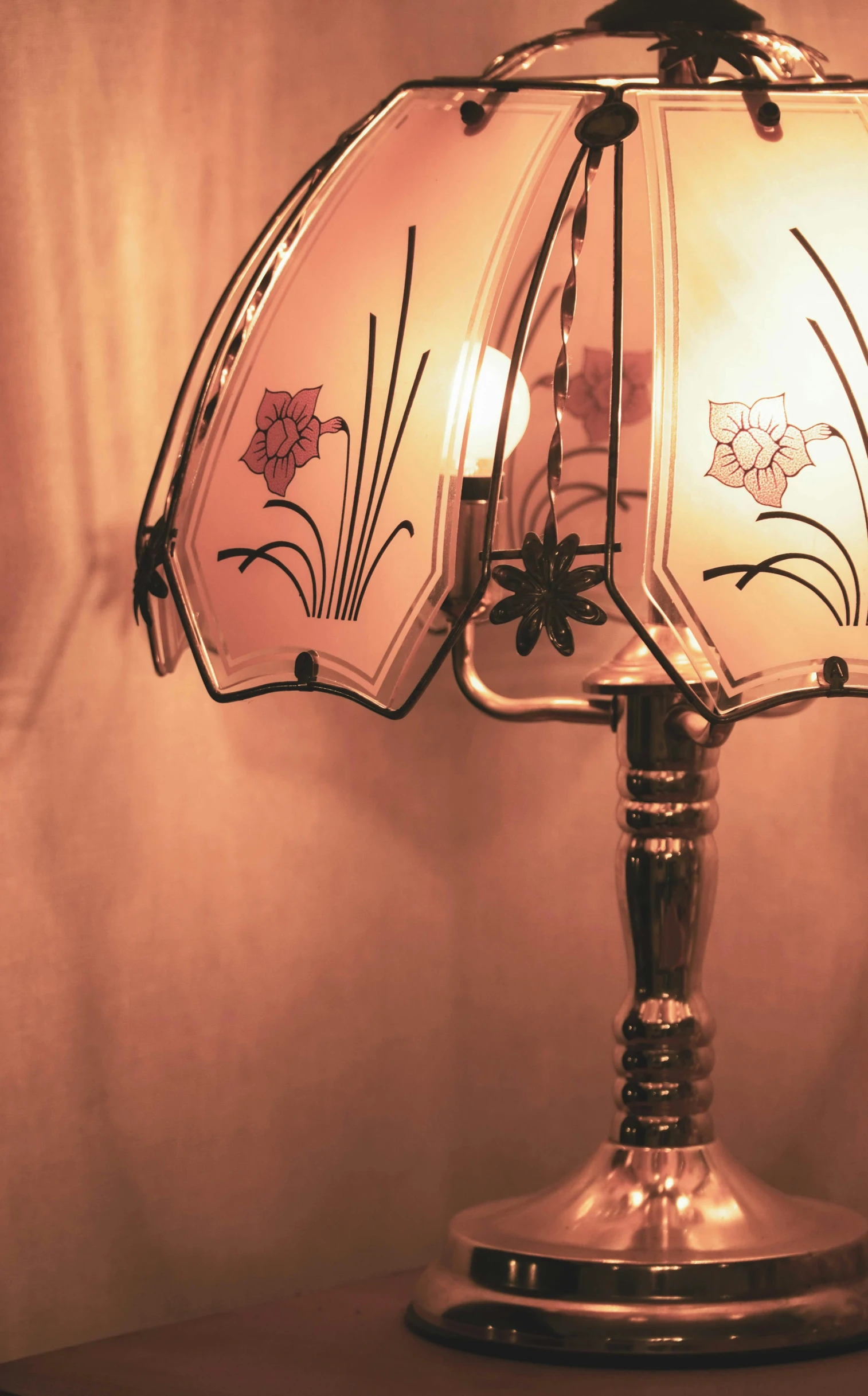 an art nouveau lamp is seen on a table