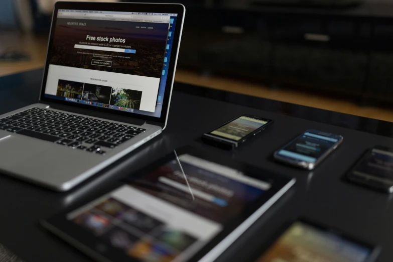 a table with two laptops, one on display and one off