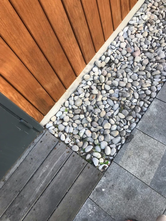 a sidewalk that has stones on it