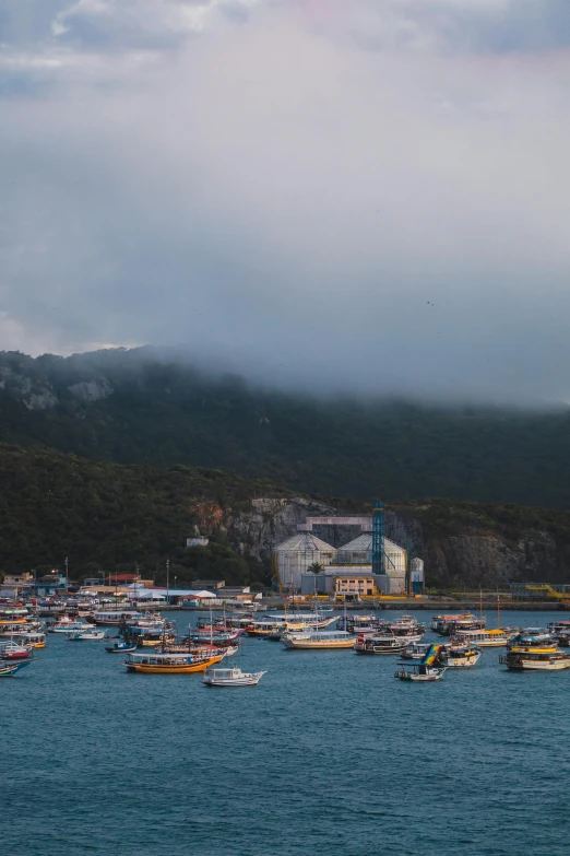 a body of water with a lot of boats floating on top of it