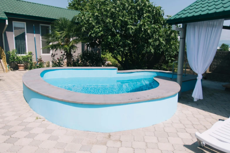 a pool that has a gazebo over it