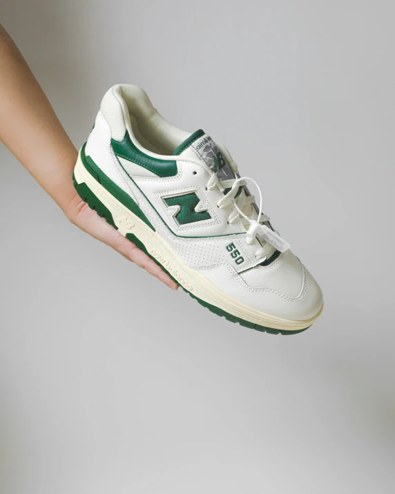 a pair of white and green shoes