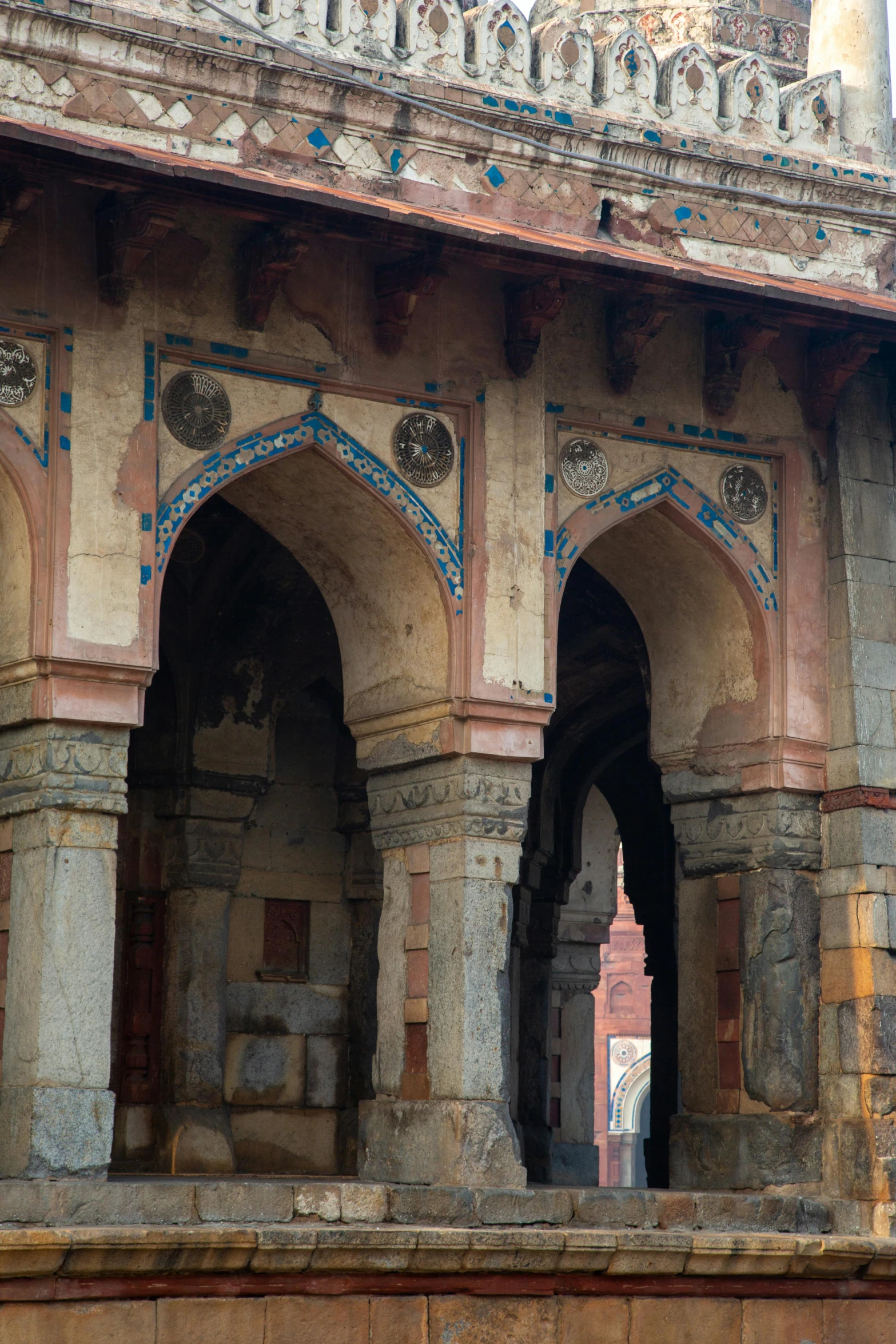 several stone arches at the entrance to a courtyard