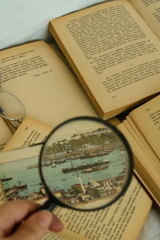 a magnifying glass being used to search a book