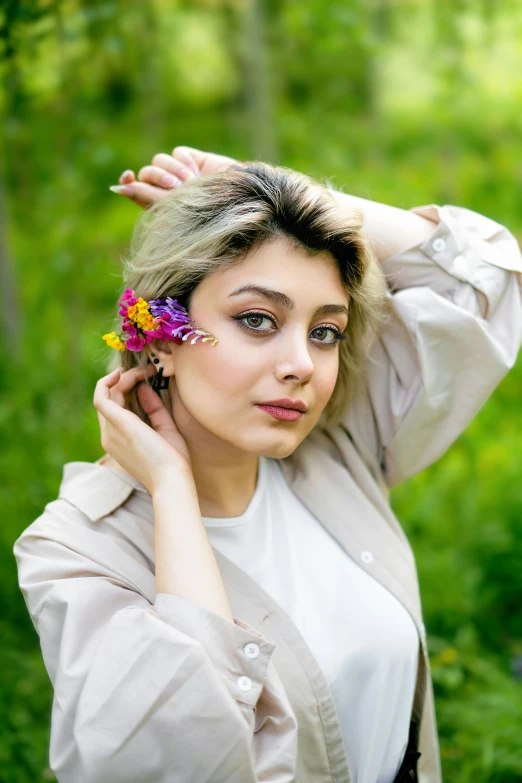 young woman with flower in her hair wearing a white shirt