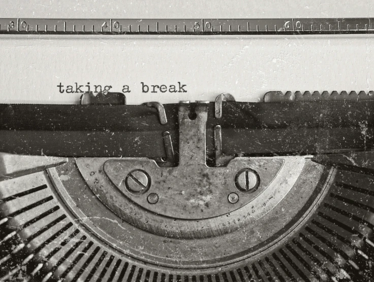 an old typewriter that says taking a break