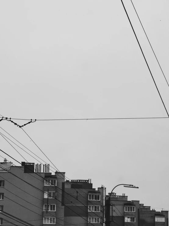 a line is in the sky as power lines run above