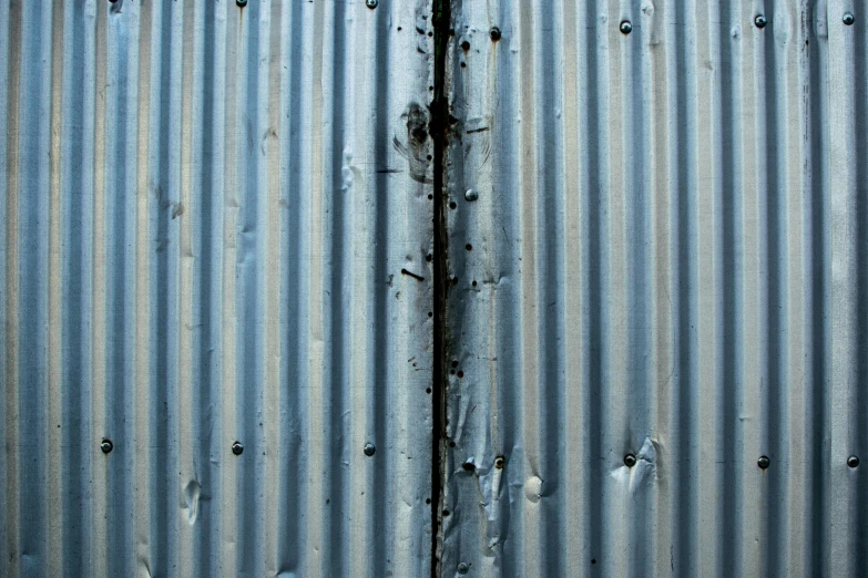 a metal surface with holes in it