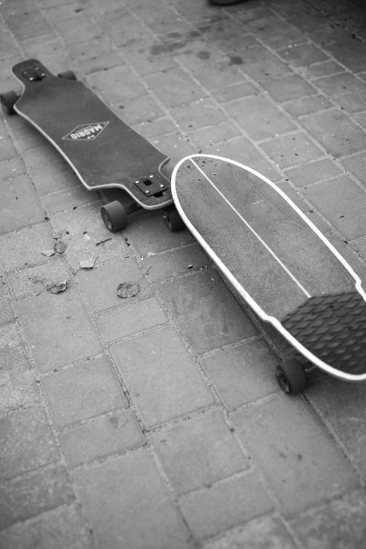 a black and white po of a skateboard on a street