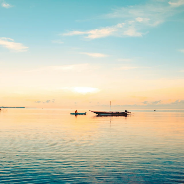 a couple of boats on a big body of water