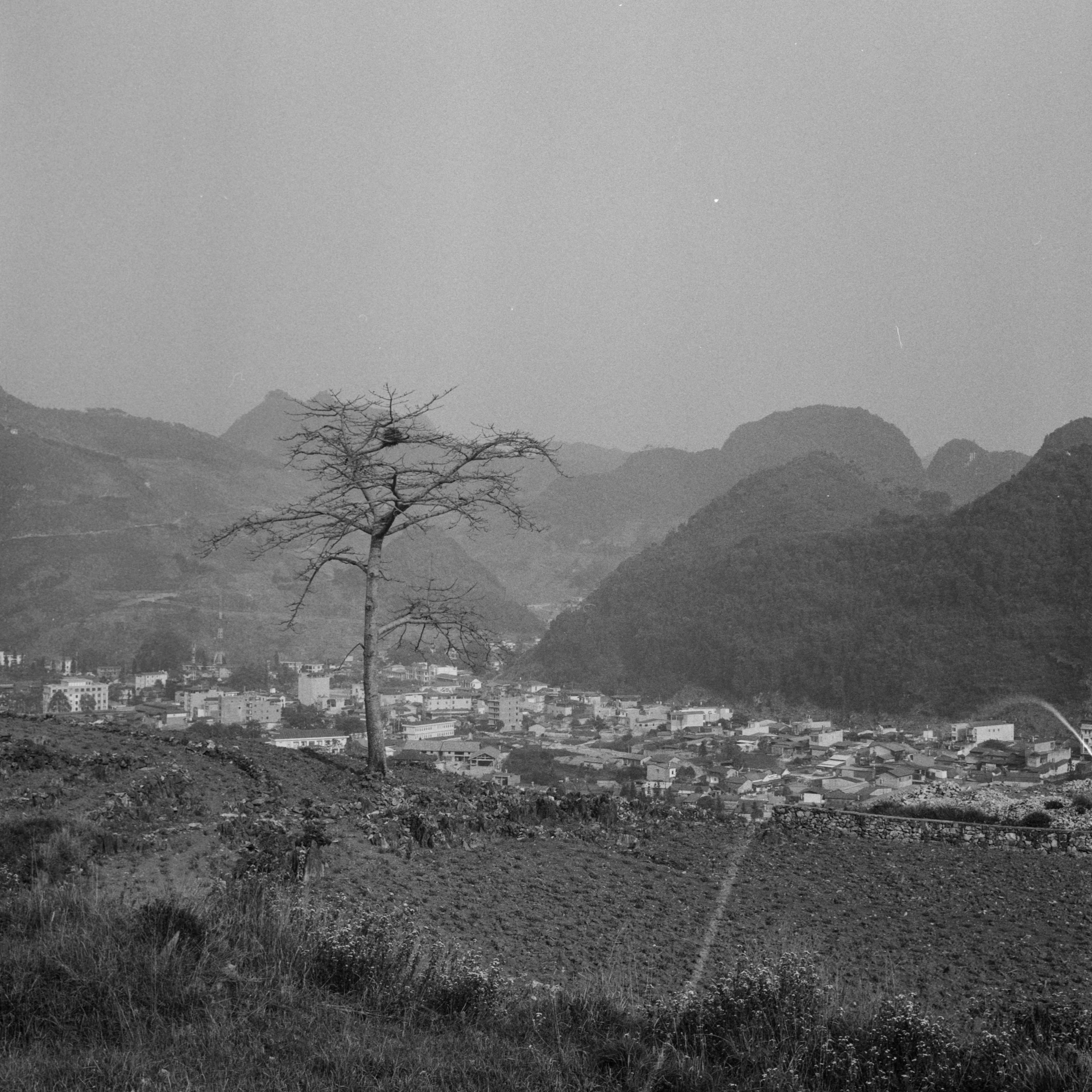 a black and white po of the hills surrounding town