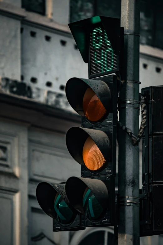 a street light and traffic signal are green