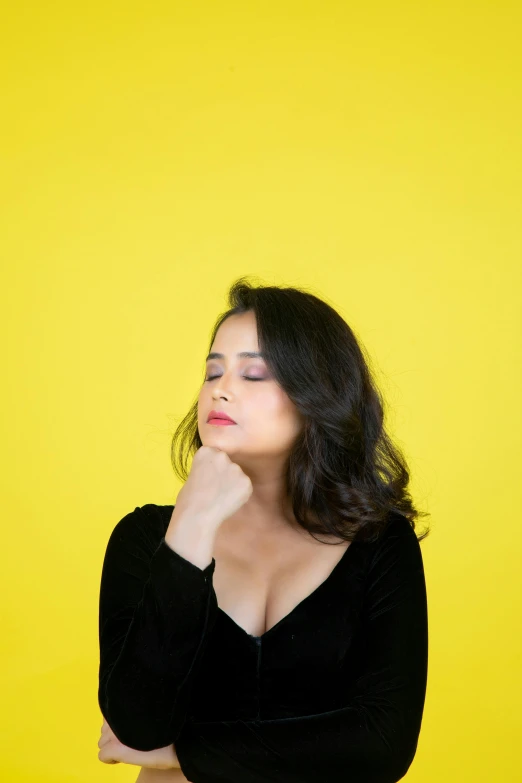 a woman with a black dress posing for the camera