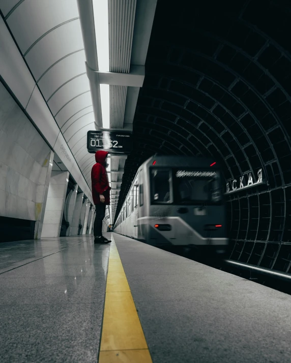 a train pulling into a subway station with its doors open