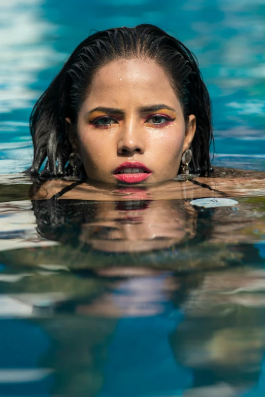 a woman that is floating in some water