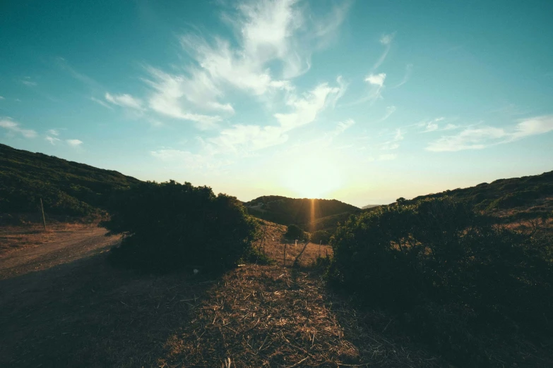 there is a sunbeam on top of a hill