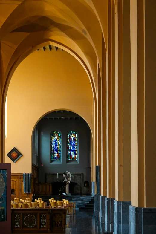 the view of an empty church with a big window