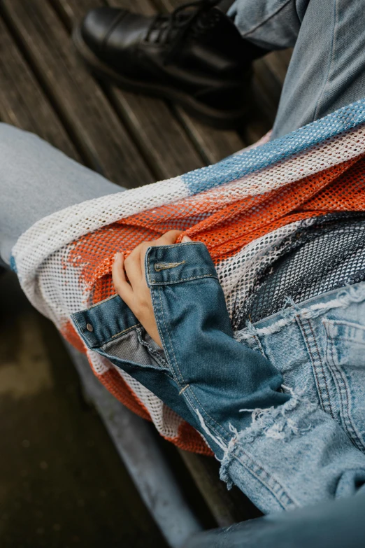 jeans are laid out neatly on the bench