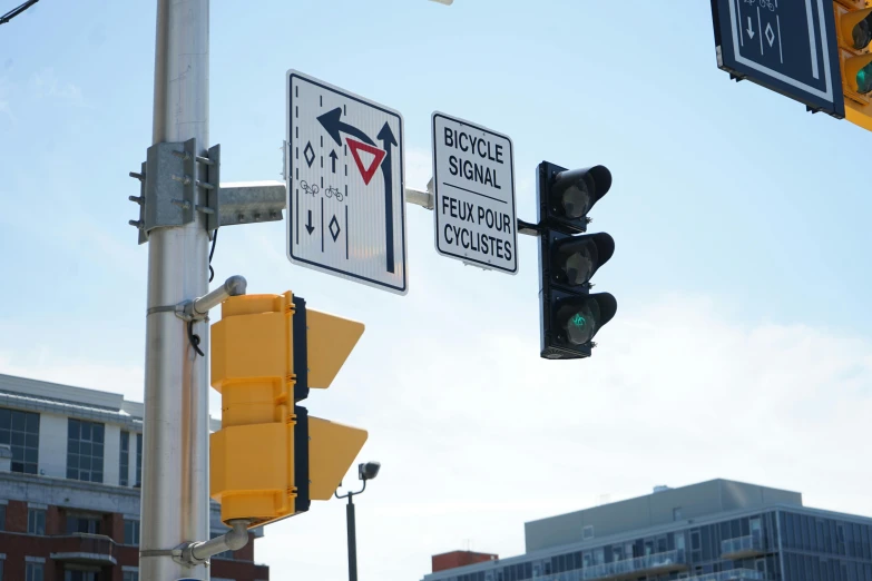 a traffic light has street signs, stop lights and no left turn