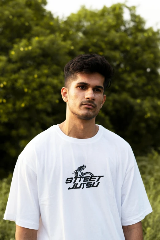 man in white shirt with red hair posing for picture