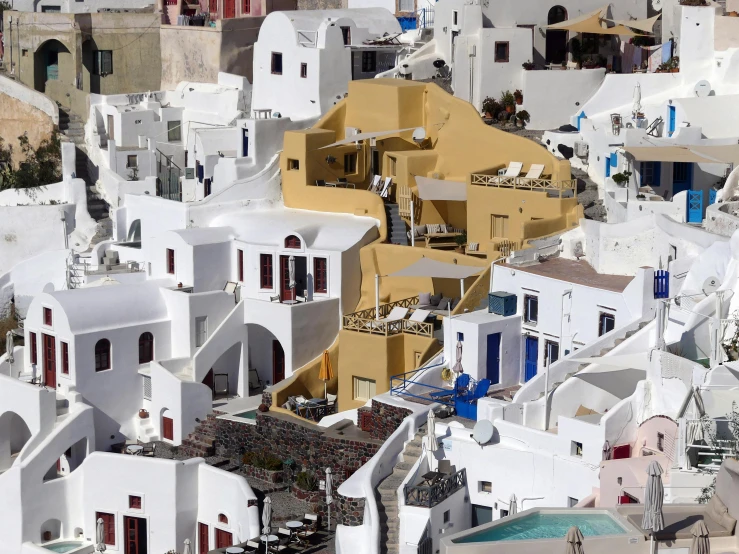 white houses are on a hill of grey rocks