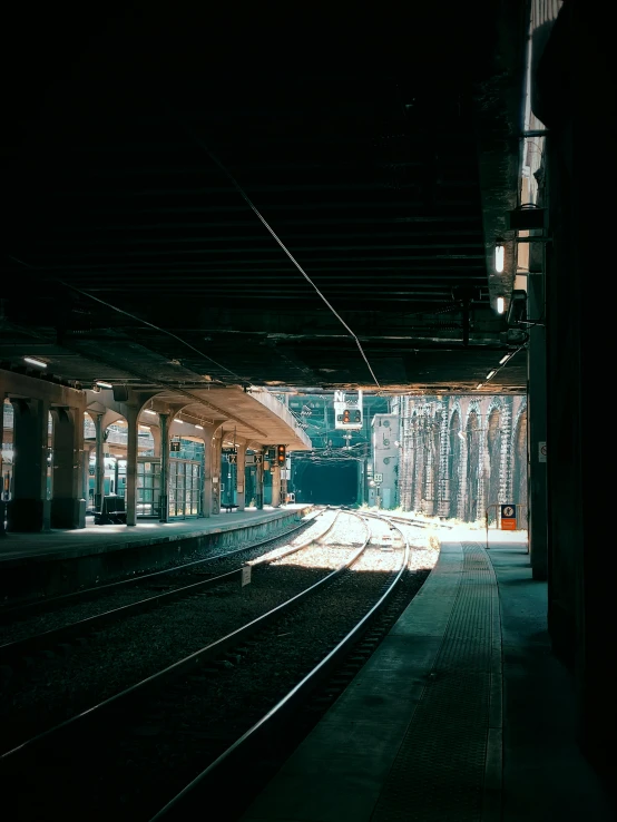 a train station with the train tracks still in place