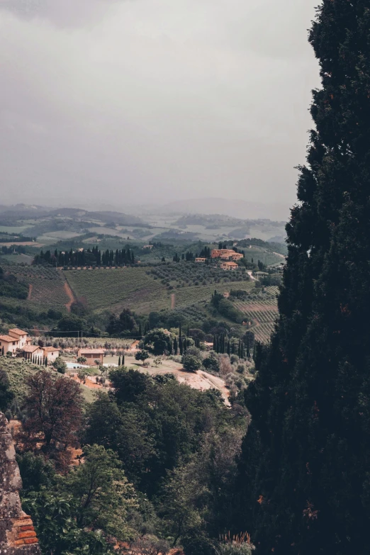 the countryside of an italian region is seen from atop the hill