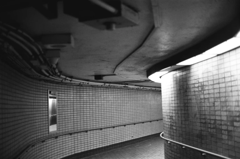 a subway station with brick walls and tile walls