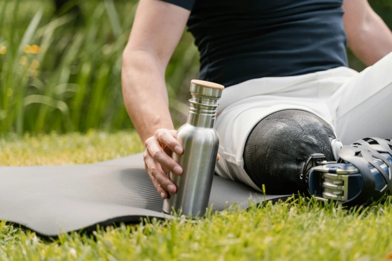 the person is relaxing while on the ground