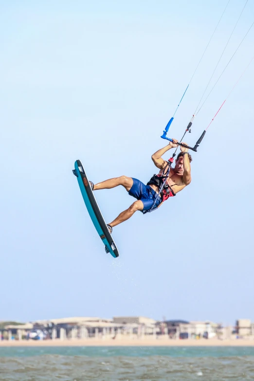 a man is in the air on a surfboard