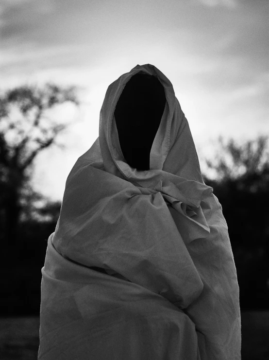 silhouettes of a woman wrapped up in cloth