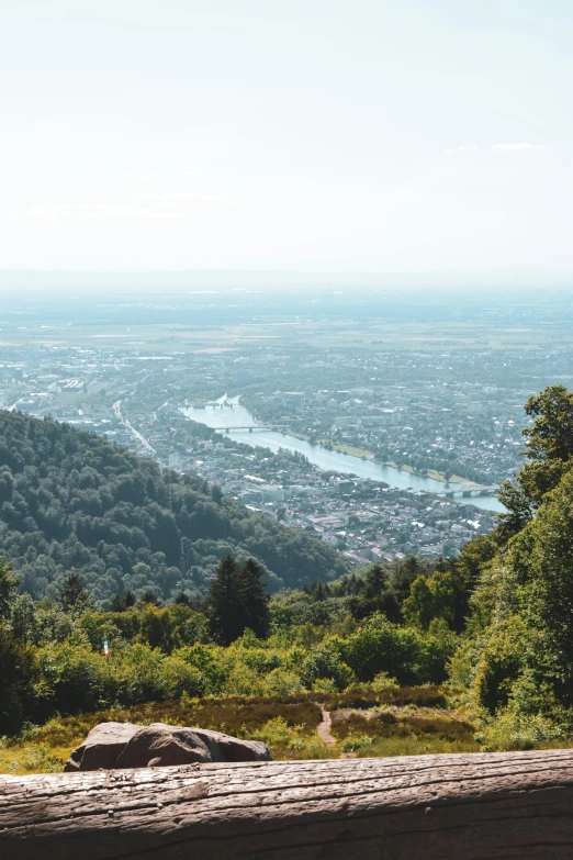 the view from the top of a hill with mountains in the distance