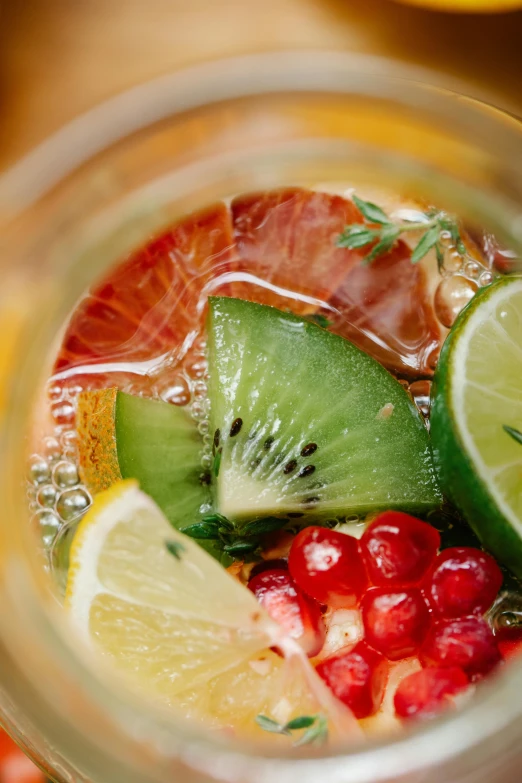 a jar filled with fruit and juice in it