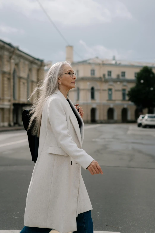 a woman walks down the street with her head down